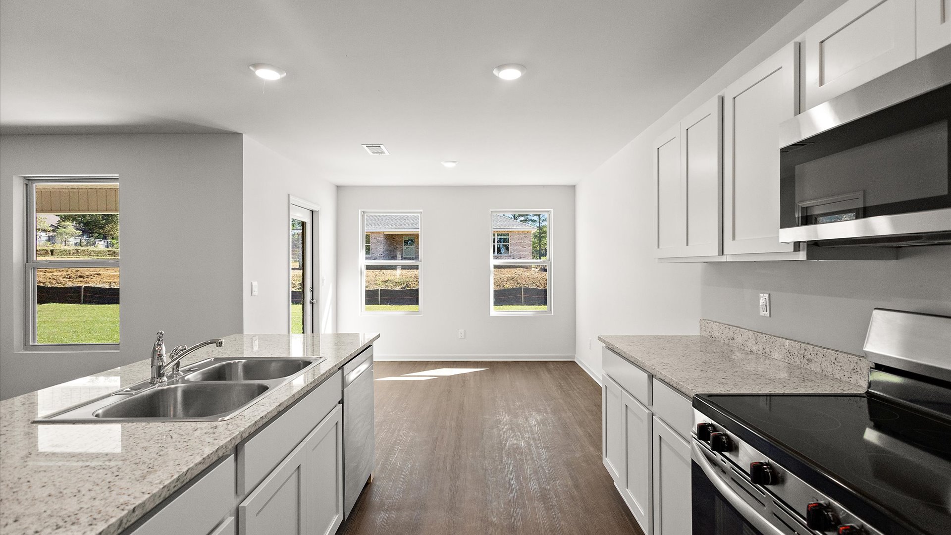 spacious kitchen with granite countertops and stainless steel appliances