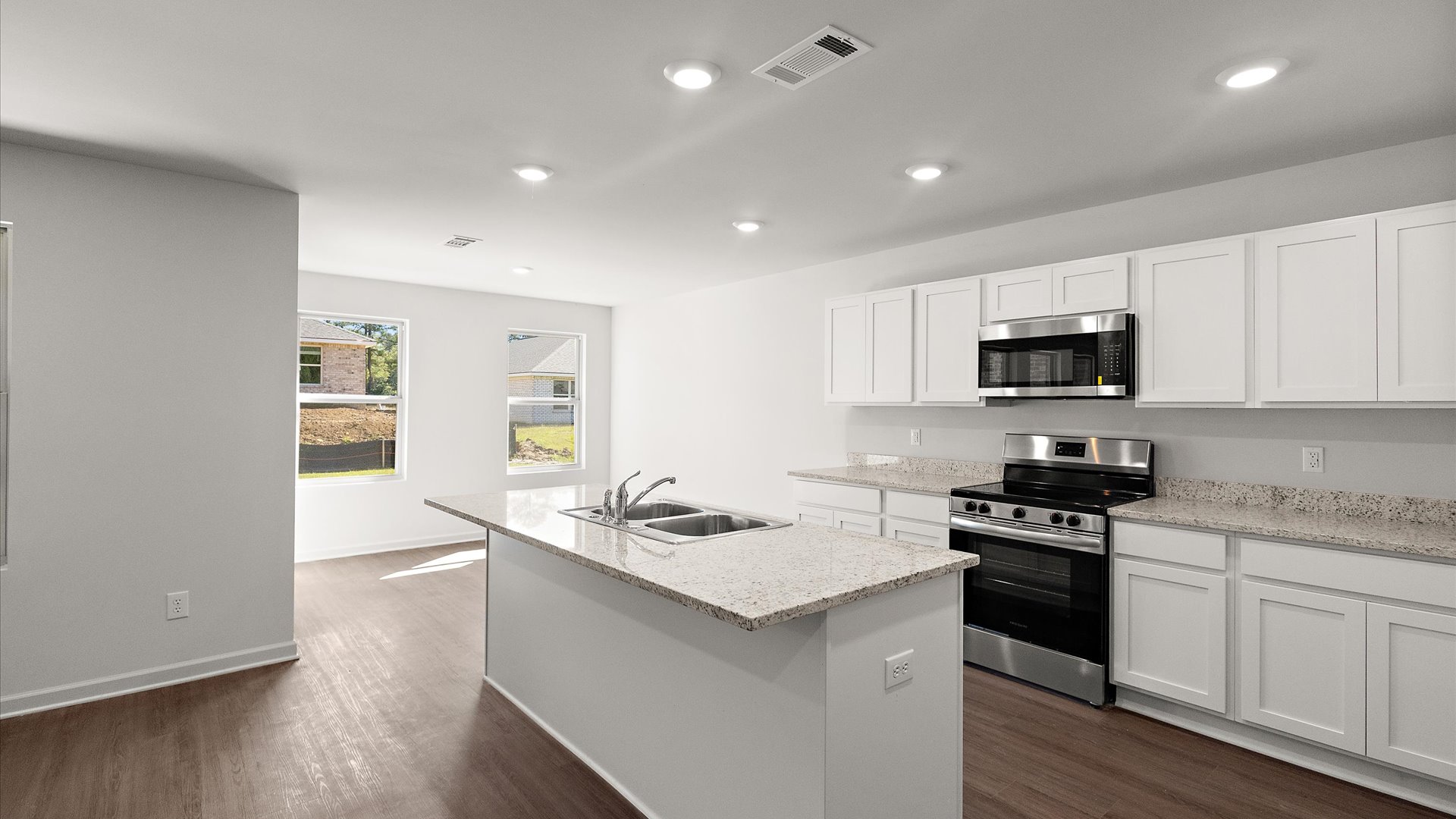 spacious kitchen with granite countertops and stainless steel appliances