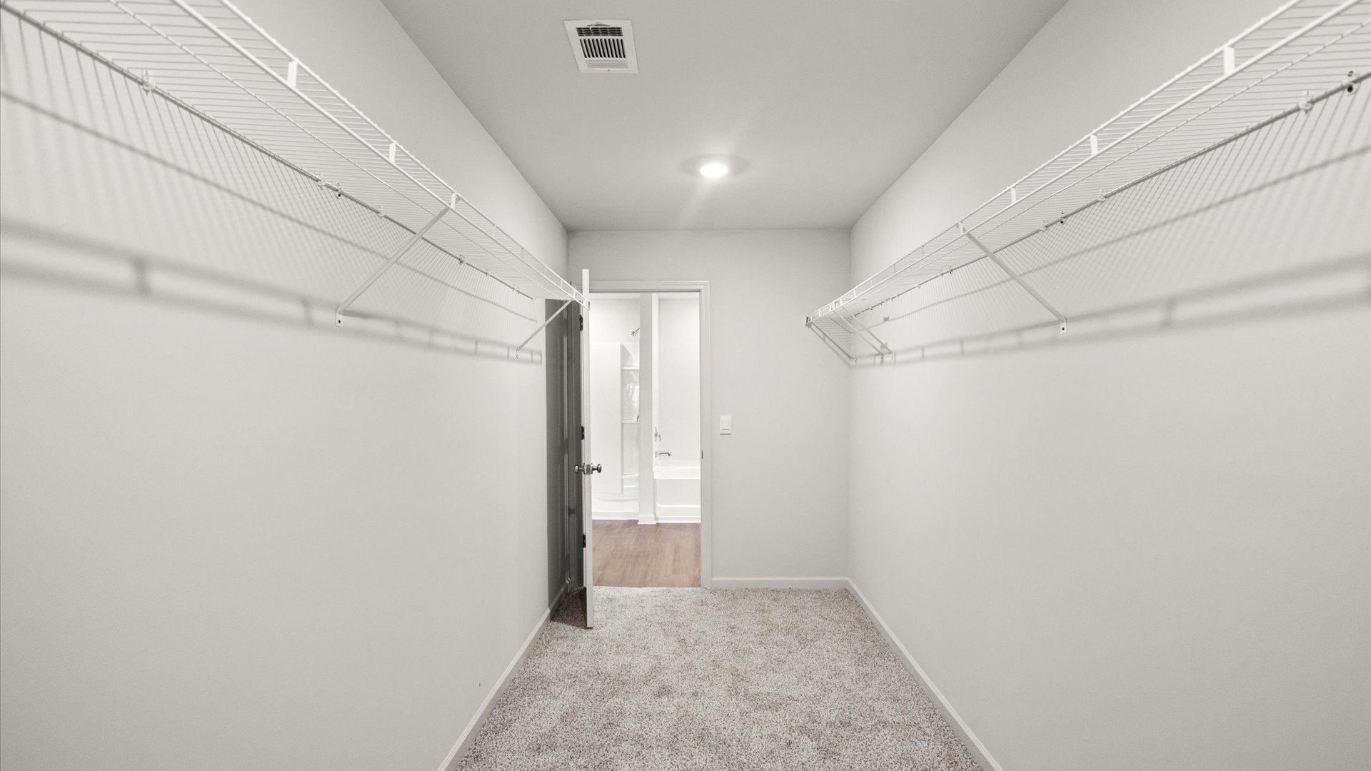 walk in closet with wire shelving