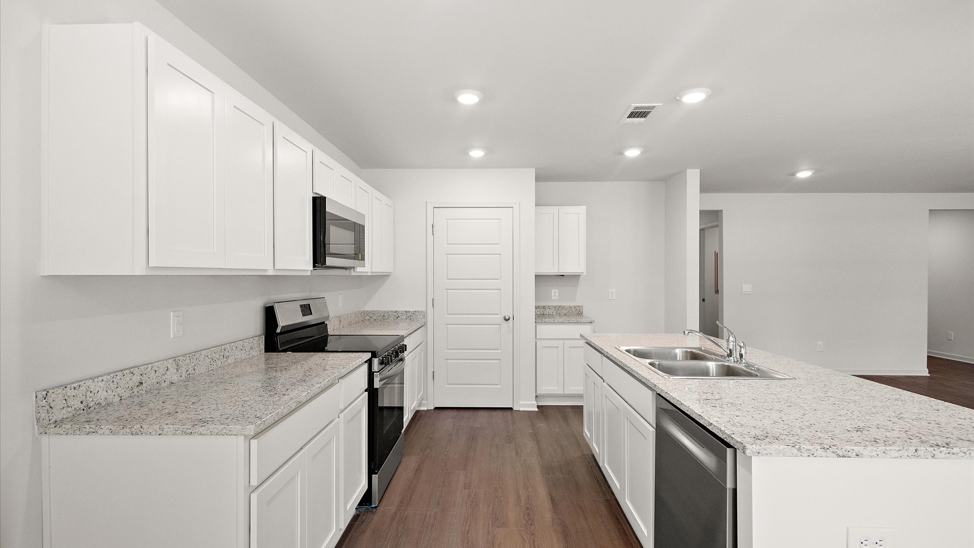 spacious kitchen with granite countertops and stainless steel appliances