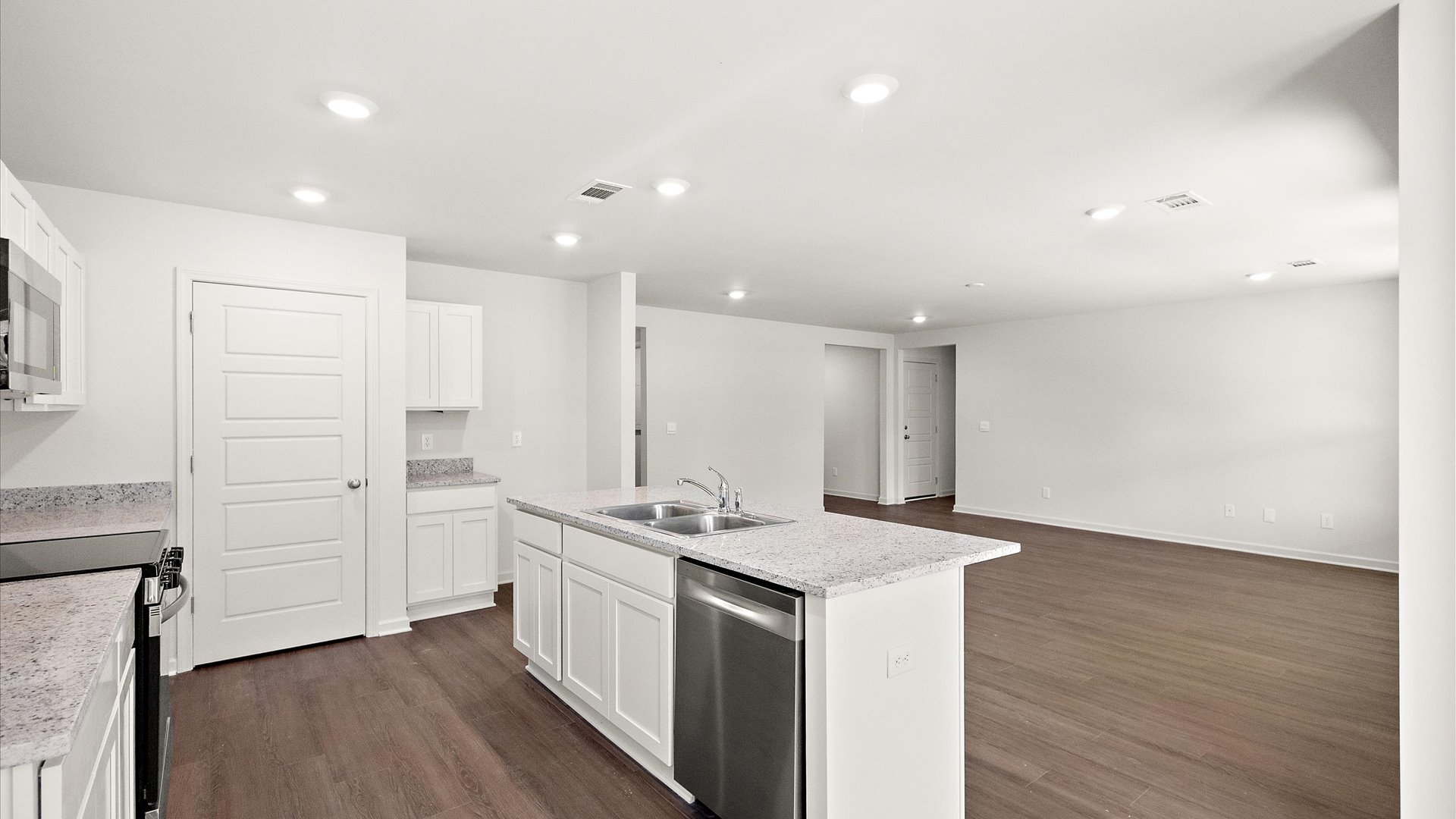 spacious kitchen with granite countertops and stainless steel appliances