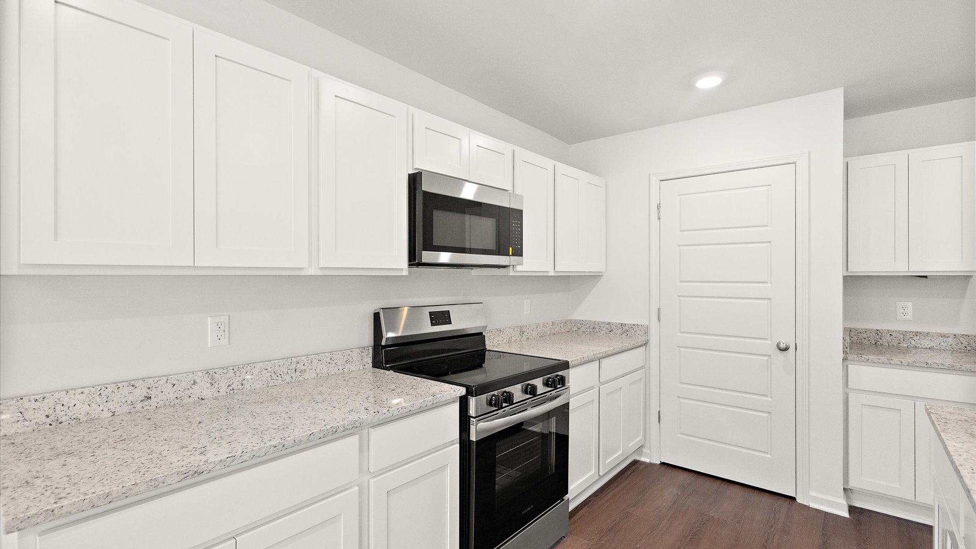 spacious kitchen with granite countertops and stainless steel appliances