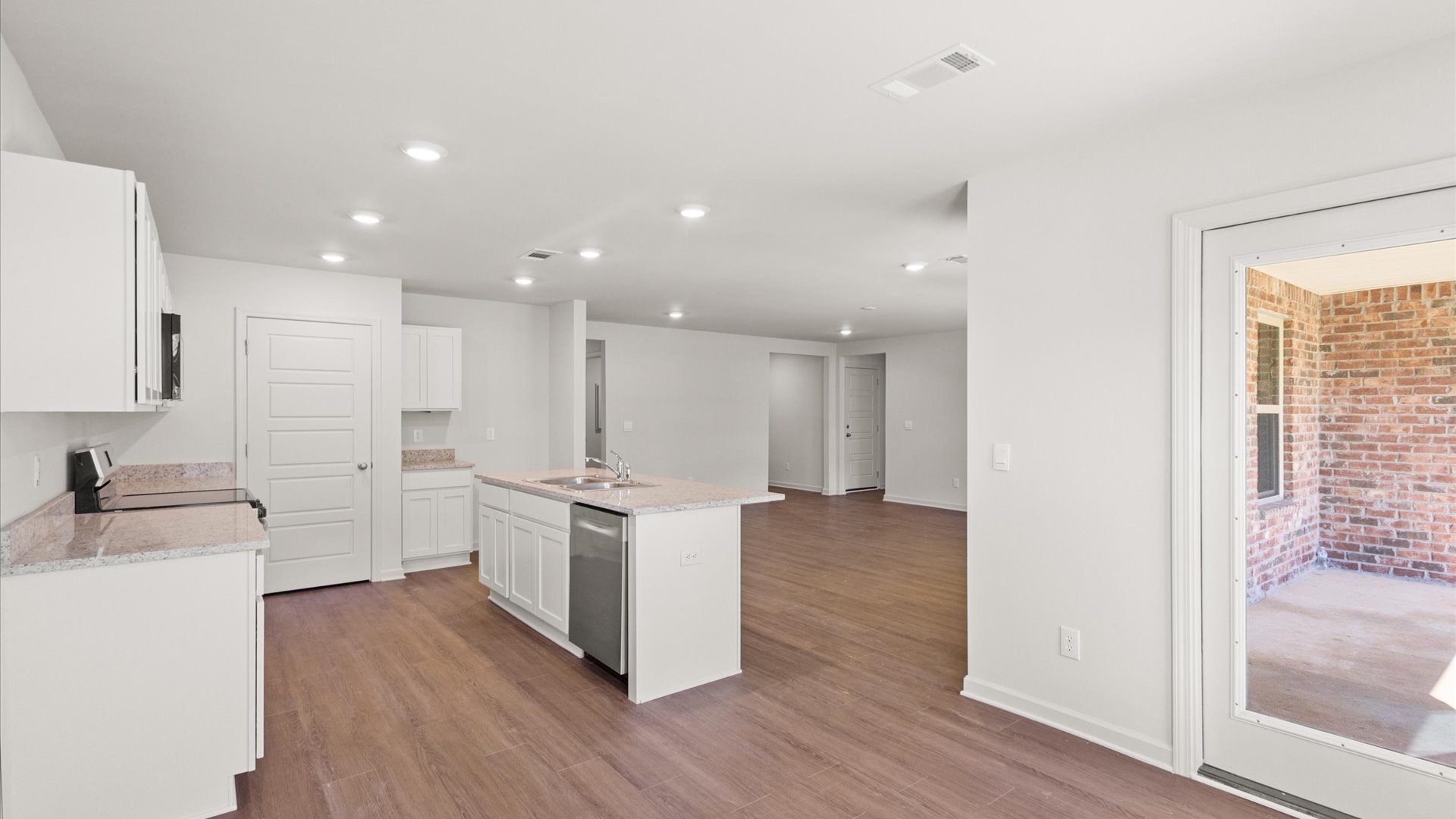 spacious kitchen with granite countertops and stainless steel appliances
