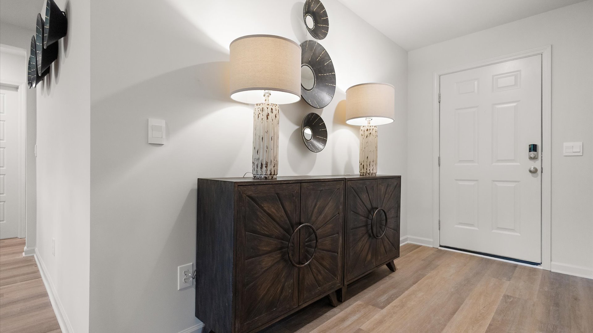 Front entryway and foyer with a hall on the left.