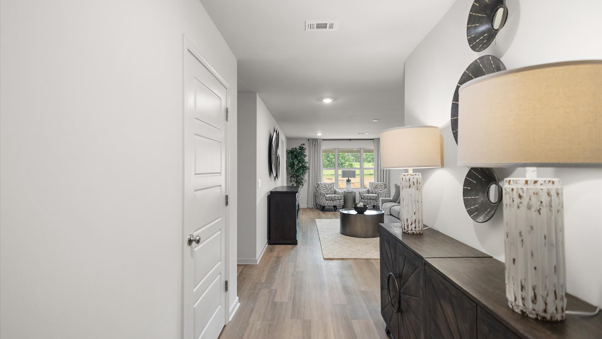 Standing into the foyer with view into the living area.