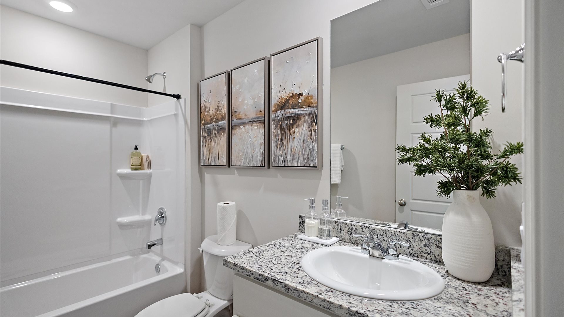 bathroom with a vanity sink, toilet and shower