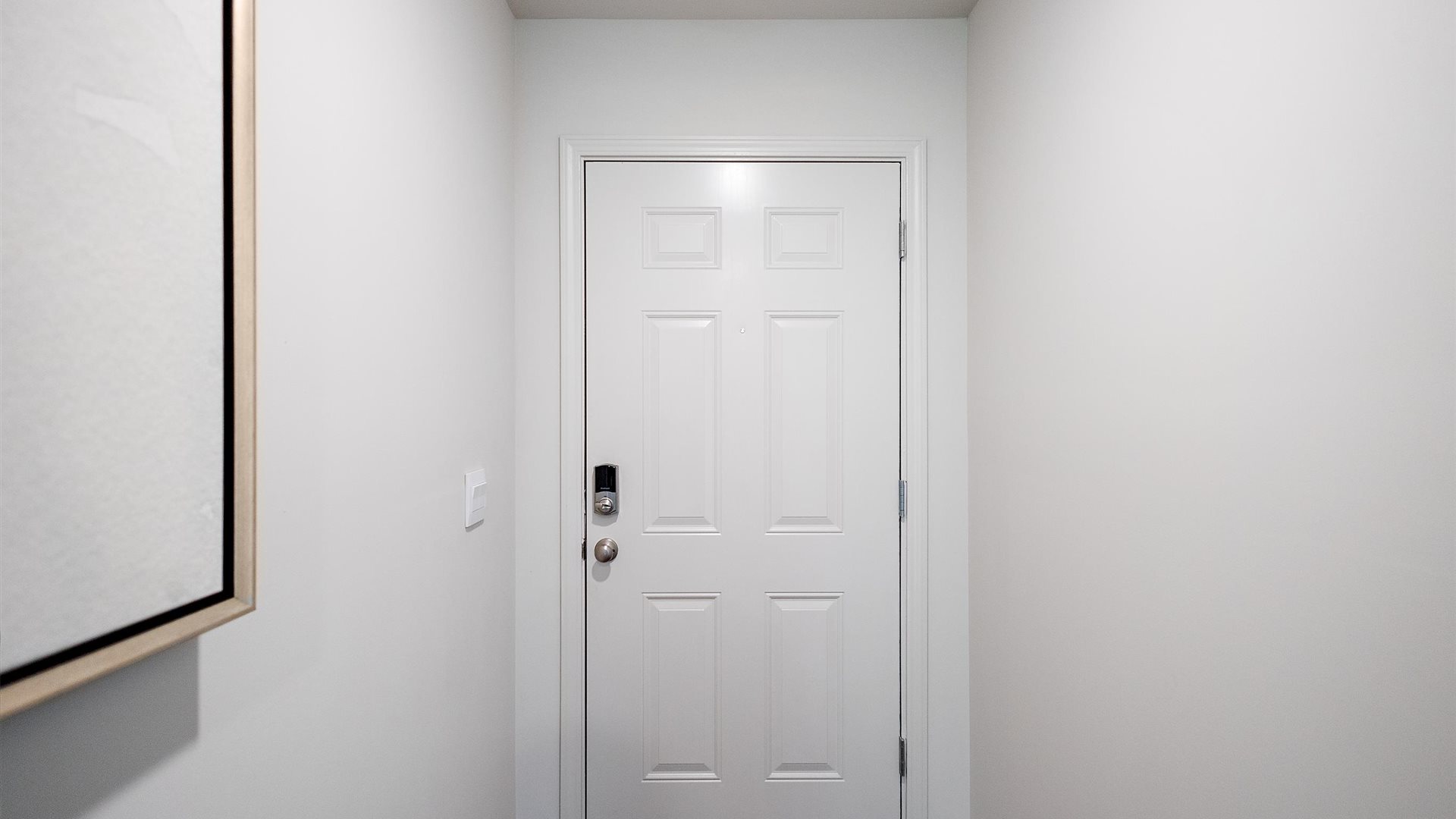 interior view of the home looking at the back of the entry way door