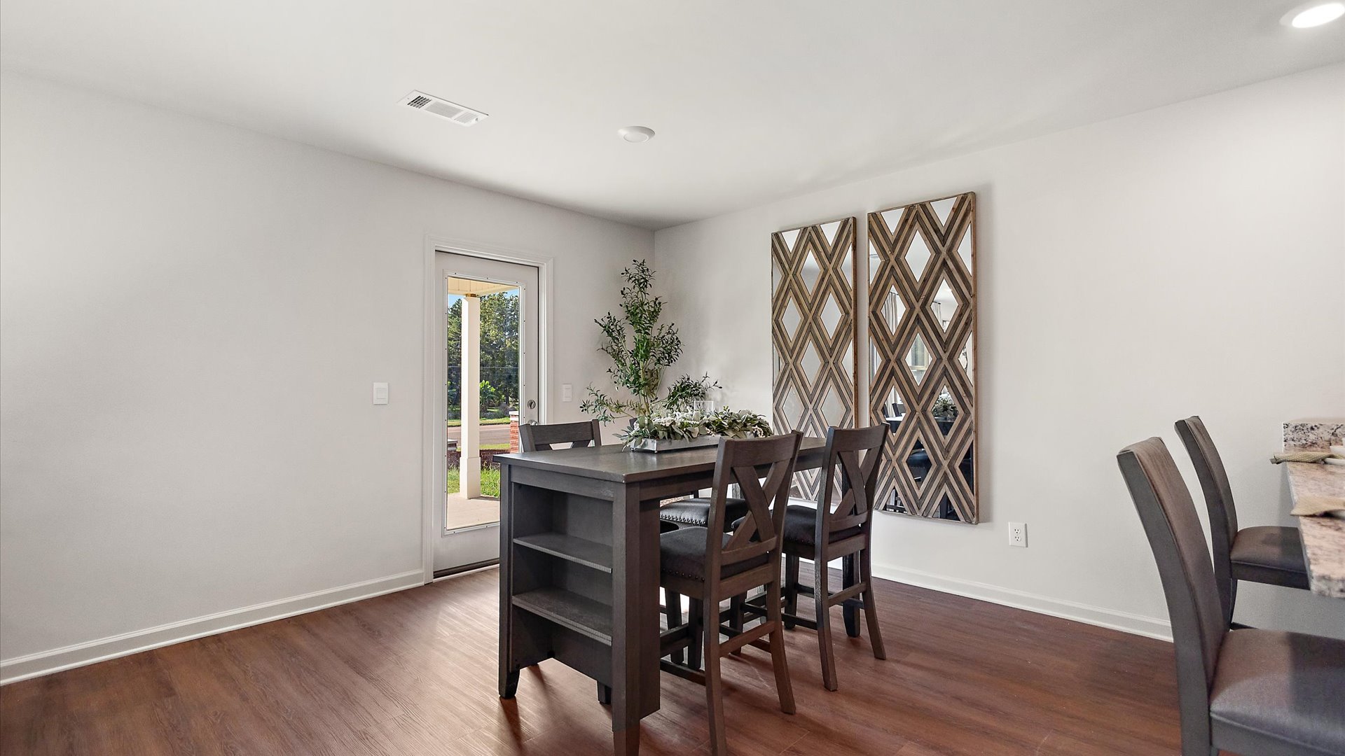 Dining space with door leading to patio