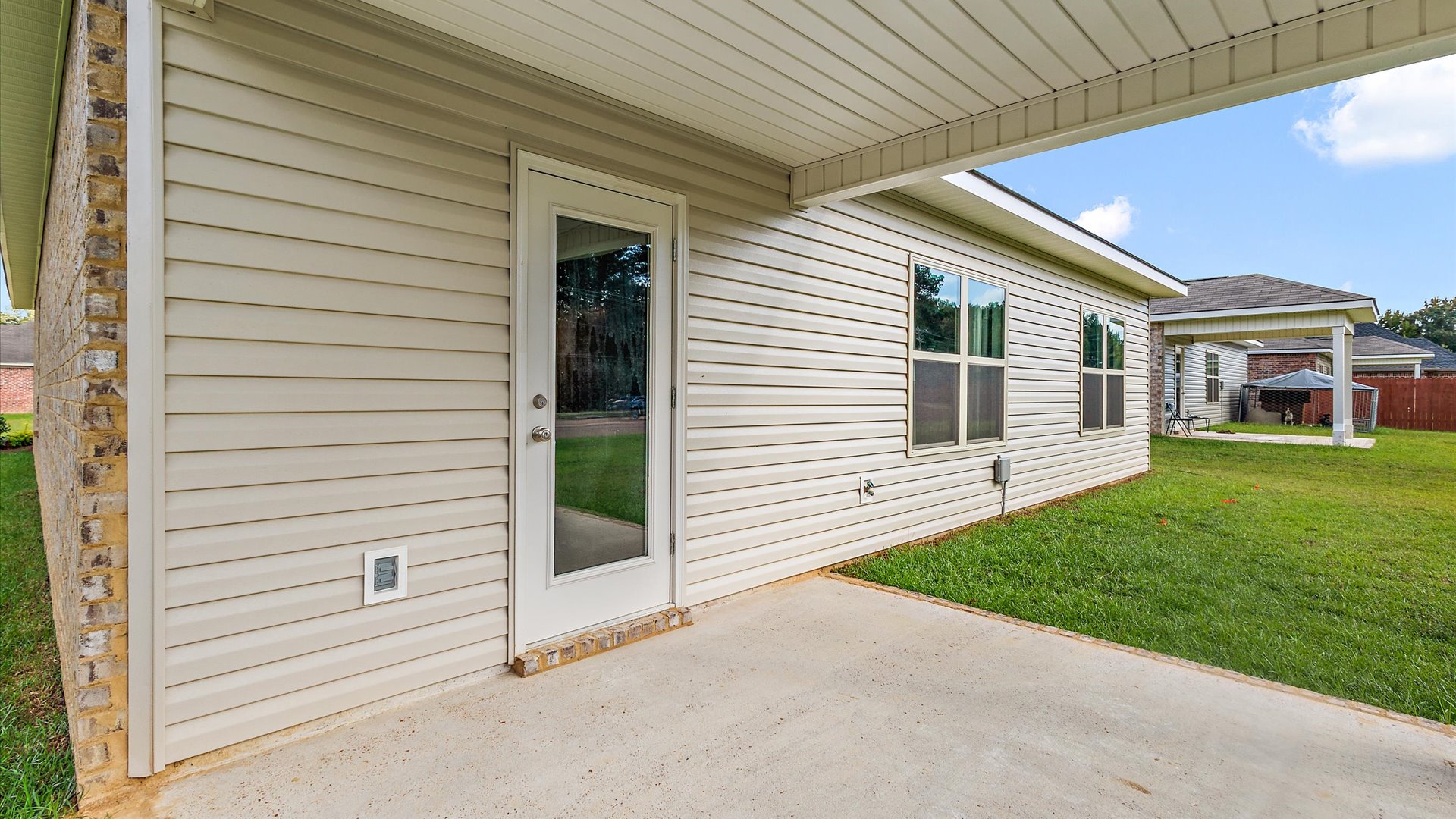 Back patio leading to greenspace