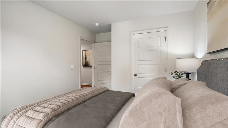 Bedroom 2 with carpeted flooring and closet