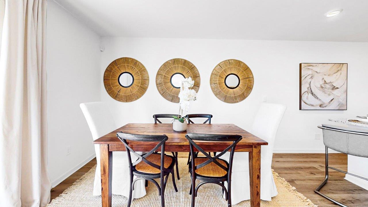 The living room is spacious and opens to the dining room