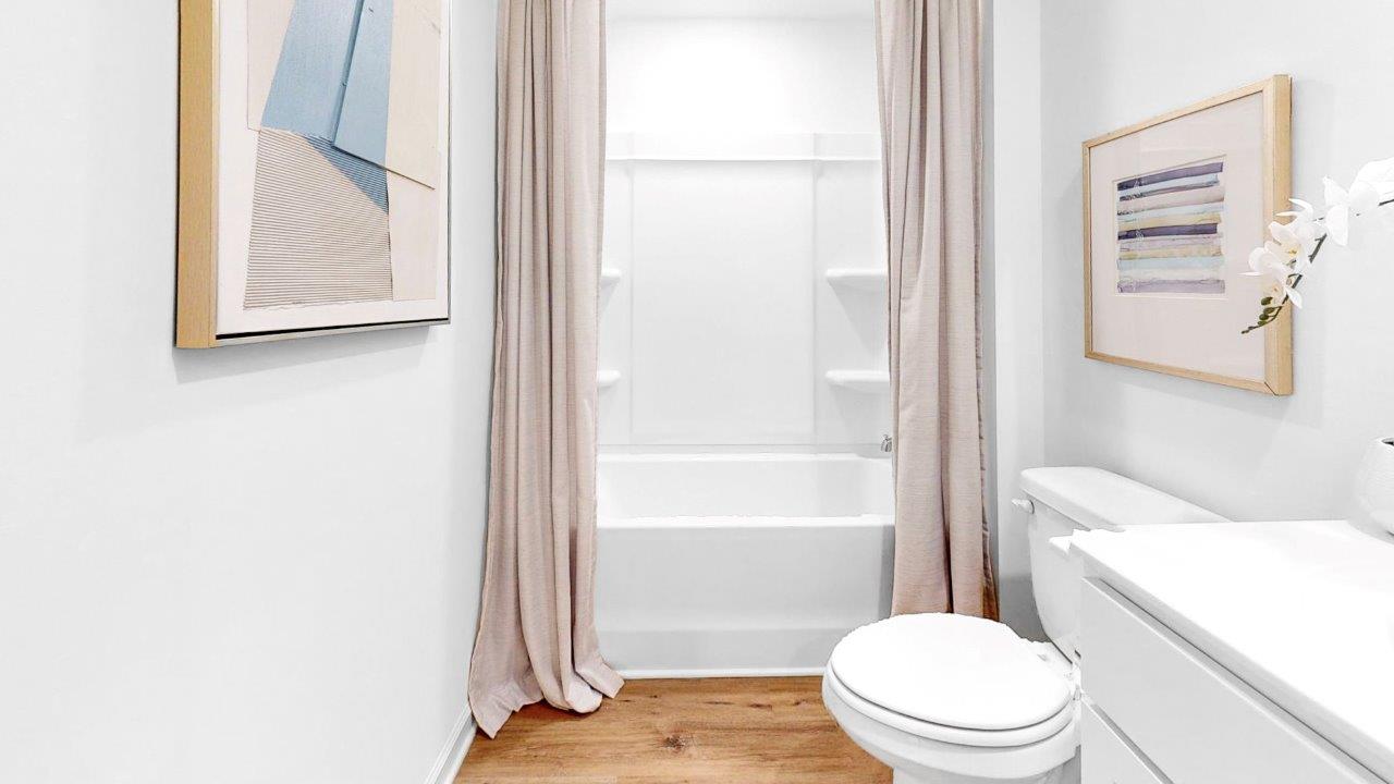 The bathroom has a tub and shower combination.