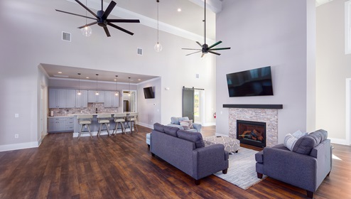 Nolen Farm clubhouse interior with seating, and television