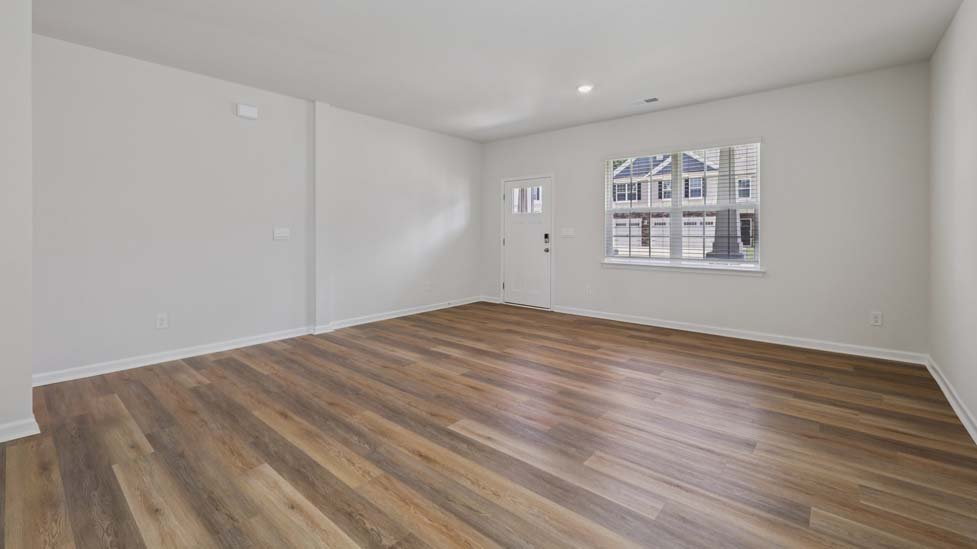 Open concept living area with large windows