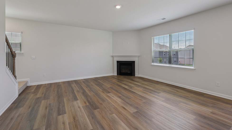 Open concept living area with large windows