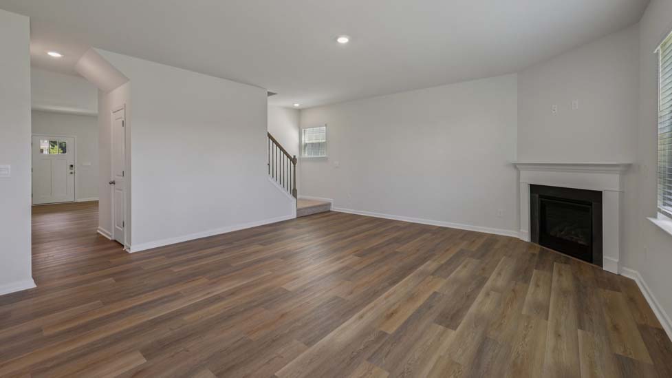 Open concept living area with large windows
