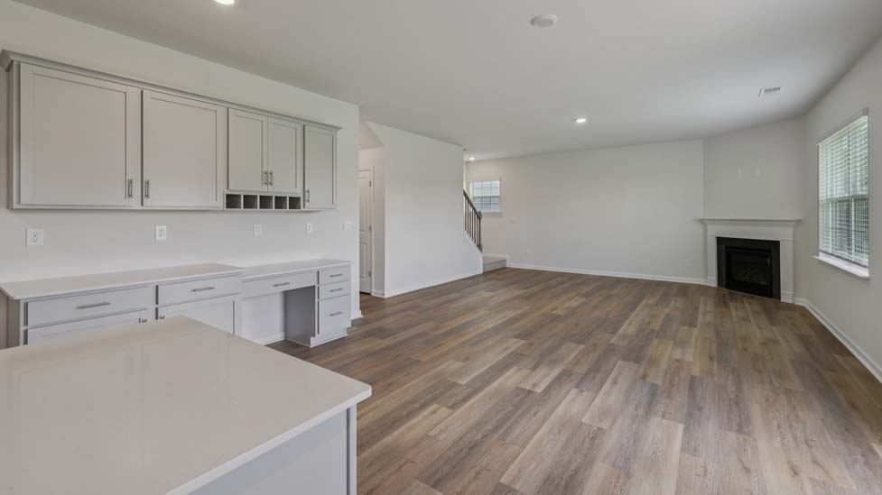 Open concept living area with large windows
