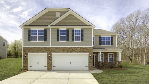 Hatteras front exterior with beige siding, stone and three car garage