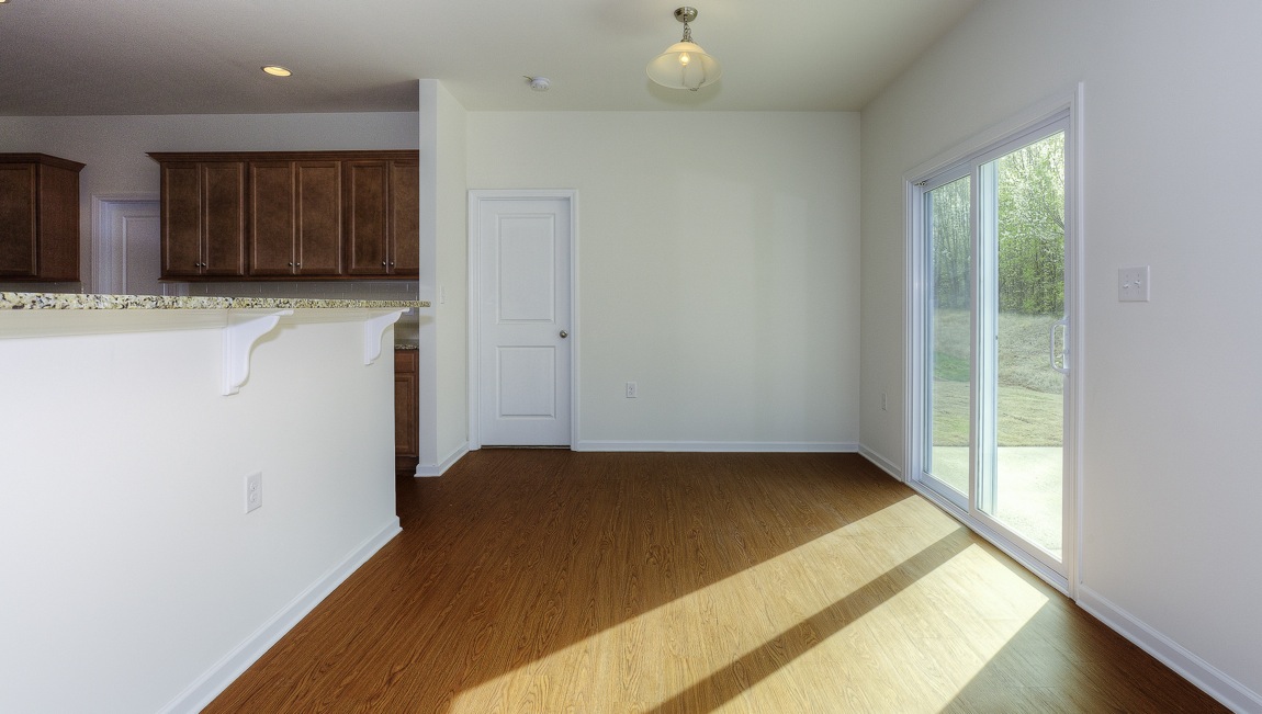 Breakfast area beside kitchen with sliding glass door