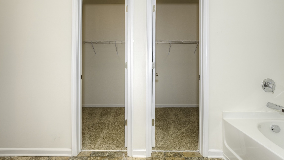 Primary bedroom walk in closet