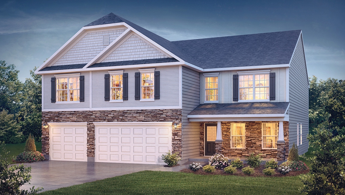 Hatteras front exterior with beige siding, stone and three car garage