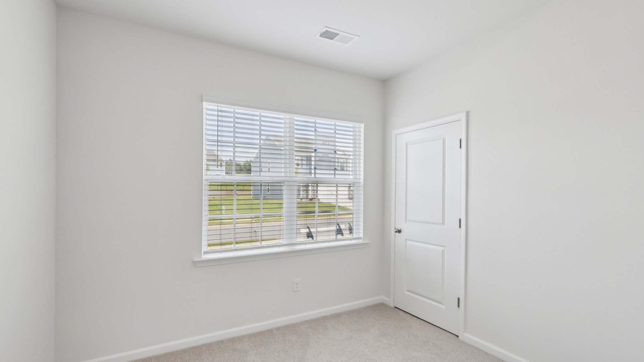 Primary bedroom with windows