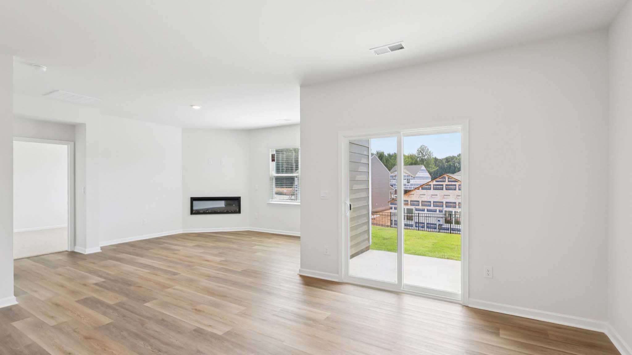 Dining area with wood floors and sliding glass back door