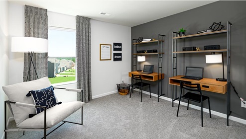 Carpeted bedroom being used as an office with small window. New Home in Charlotte, North Carolina