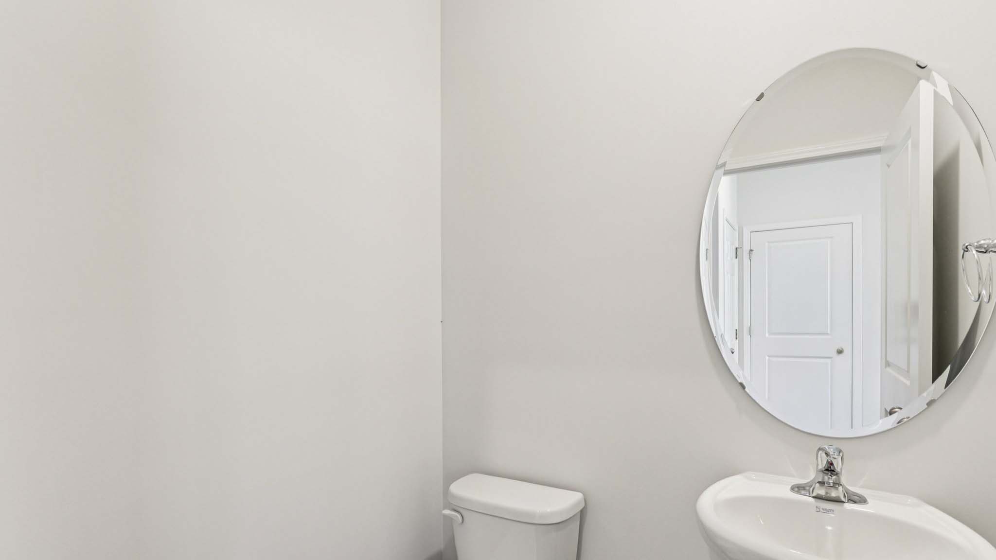 Powder bathroom with toilet and sink