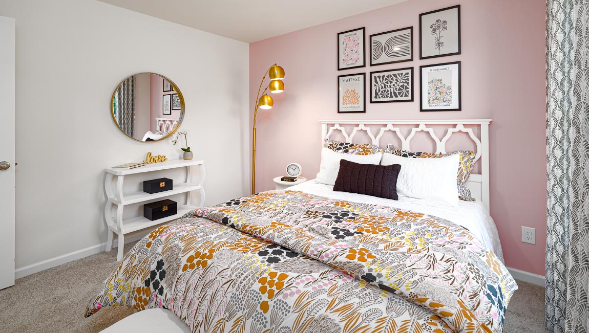 Carpeted bedroom with small window