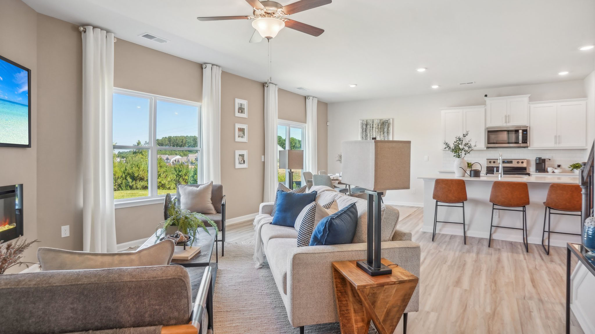 open family room with windows and fireplace