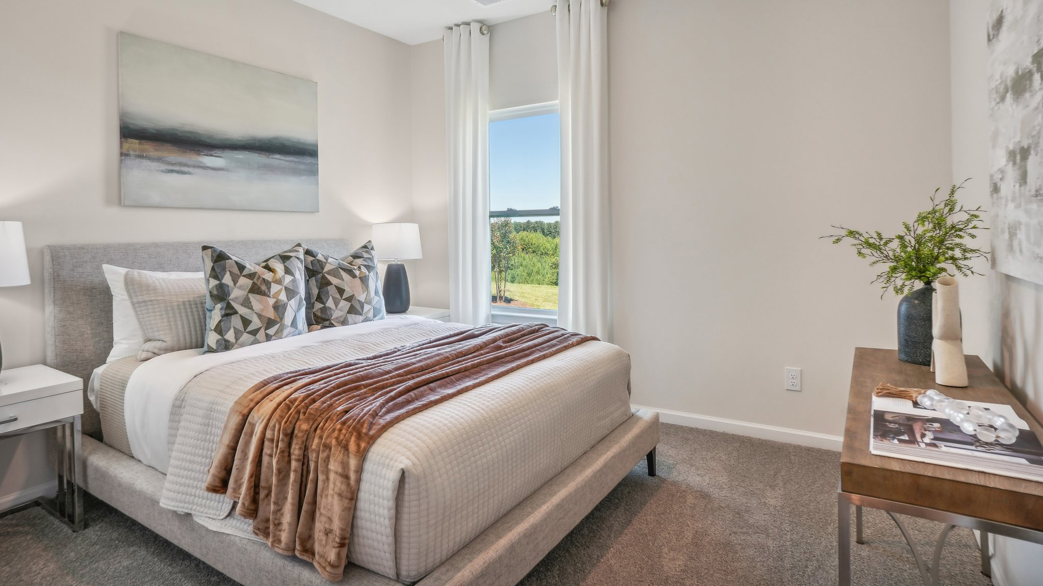 carpeted bedroom with large window