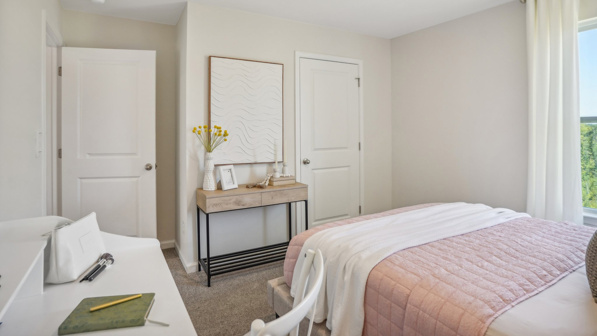 carpeted bedroom with large window