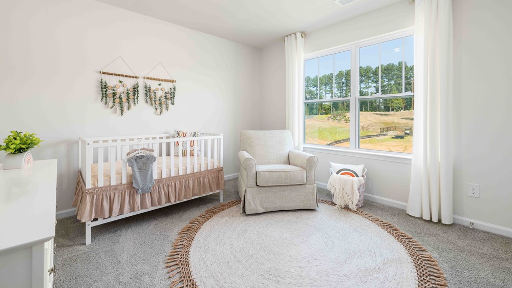 Carpeted bedroom with small window