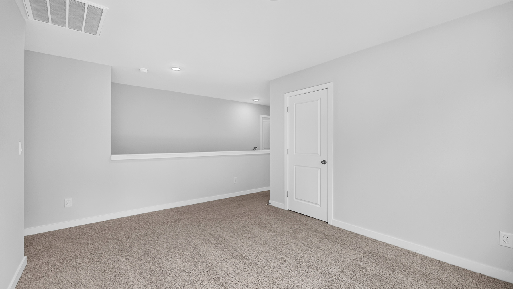 Upstairs carpeted loft area