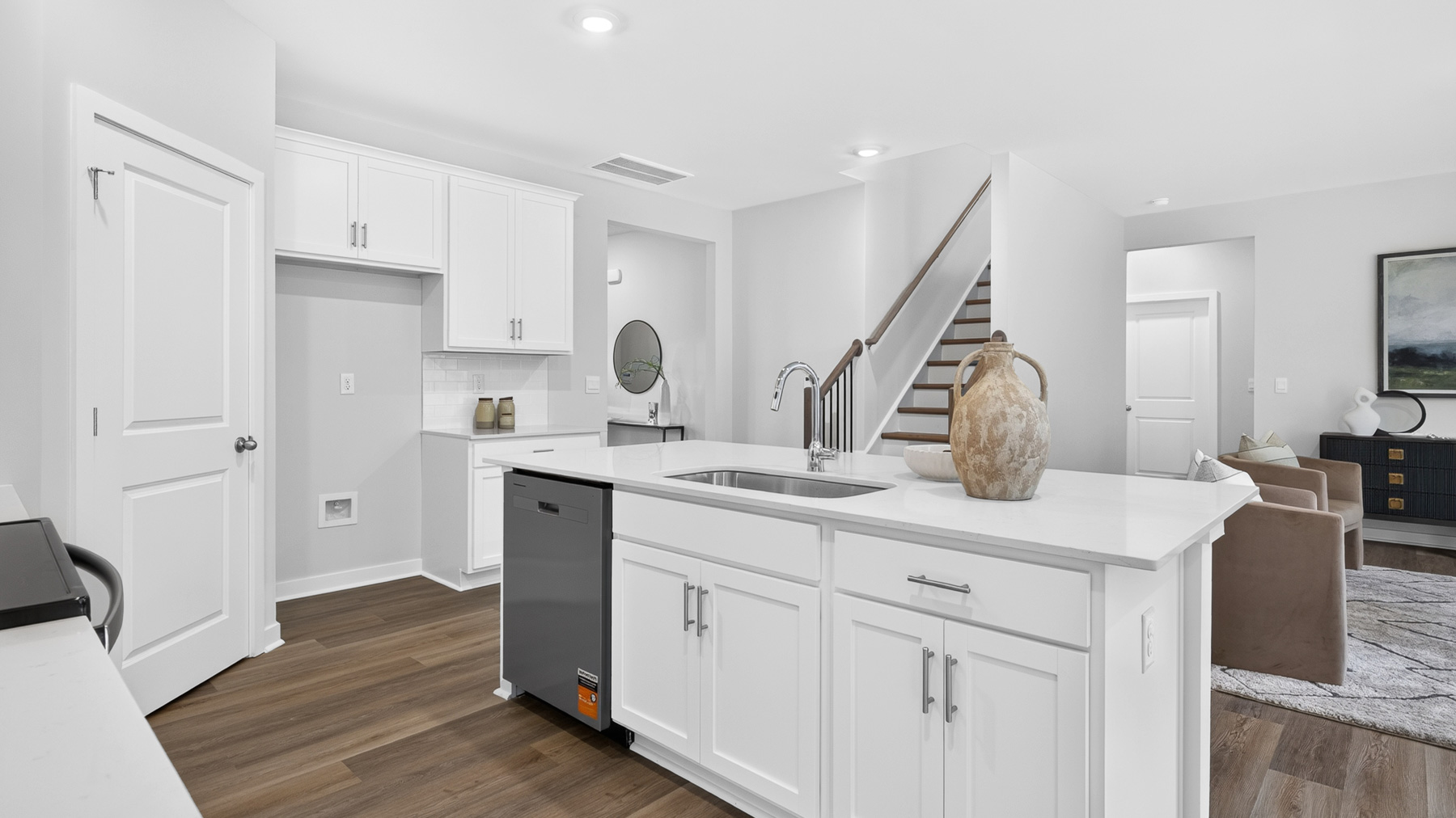 Kitchen and island with stainless appliances