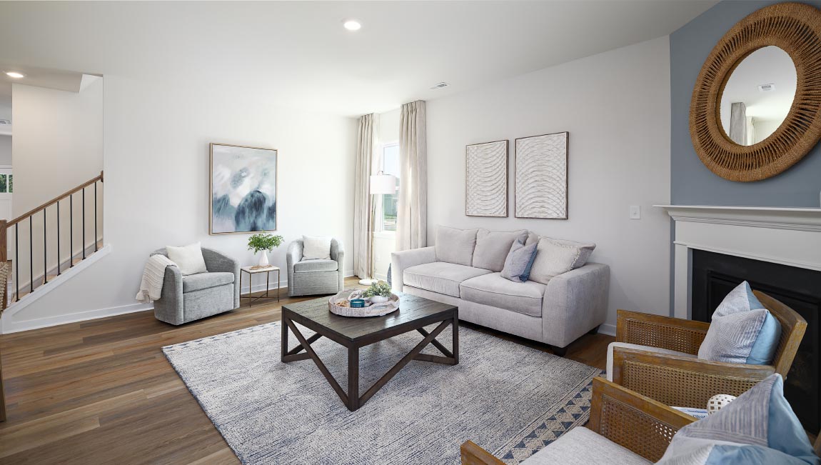 Open family room with fireplace and windows on either side