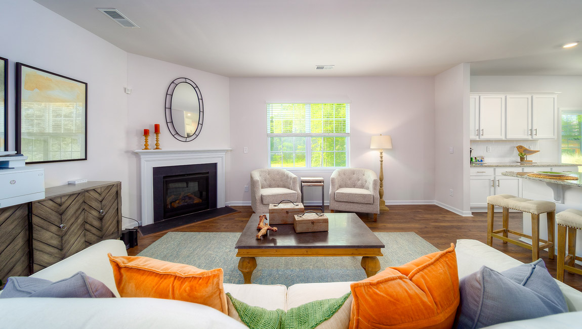 Open family room with windows and fireplace