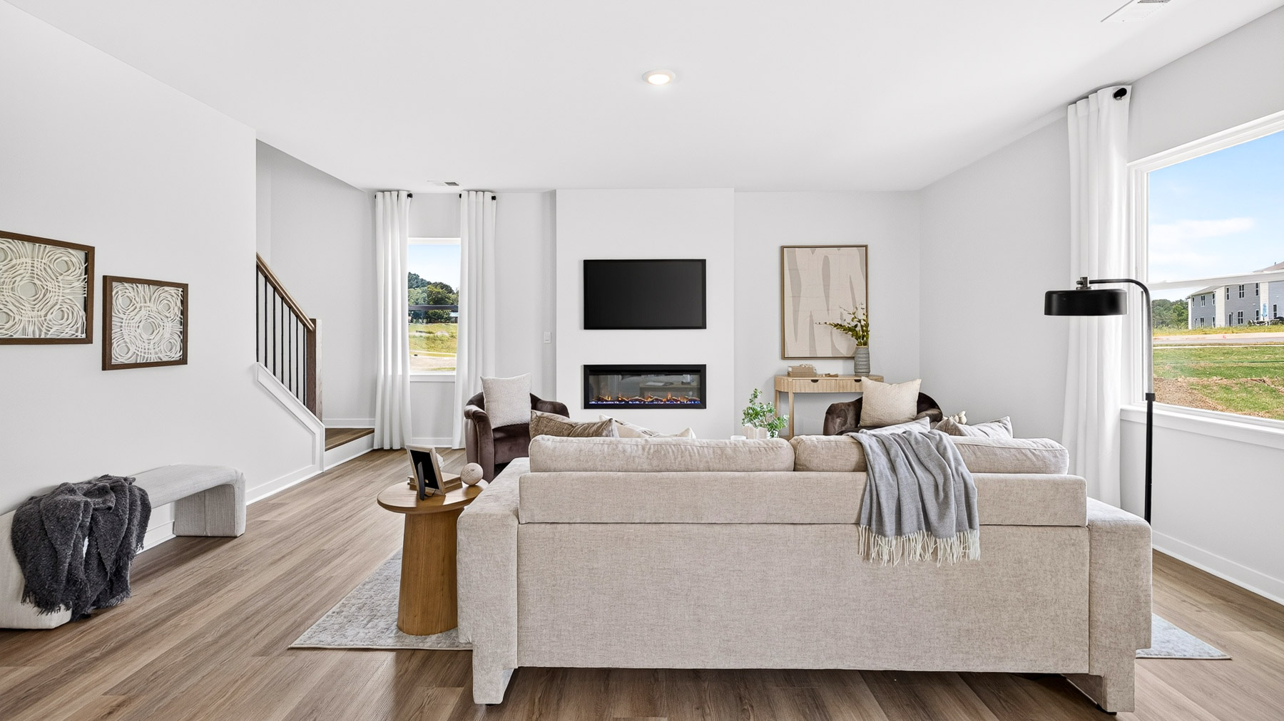 Living room area with fireplace and windows