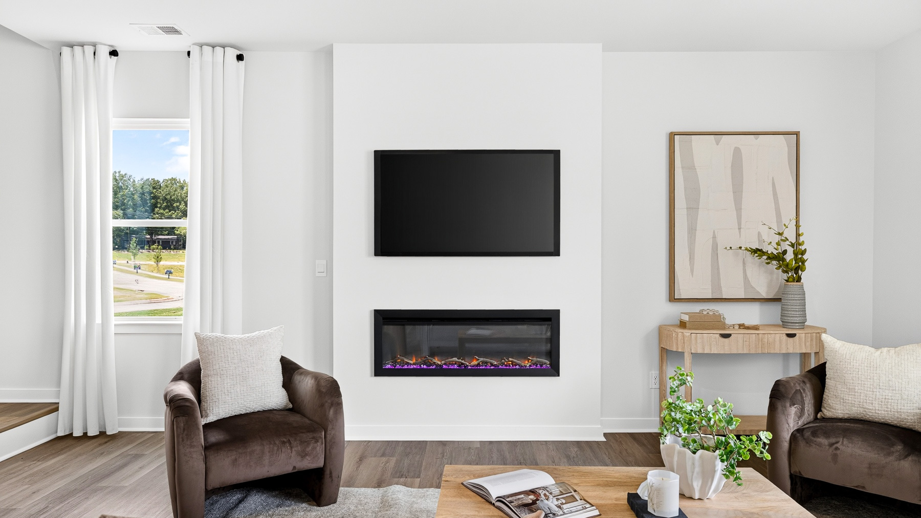 Living room area with fireplace and windows
