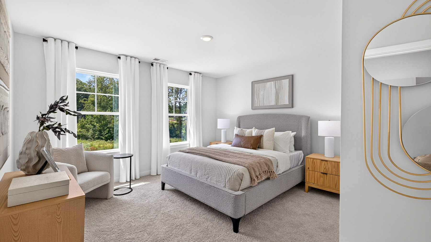 Carpeted bedroom with windows