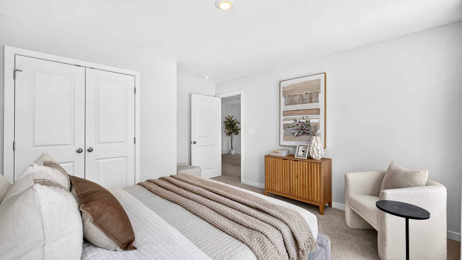 Carpeted bedroom with windows