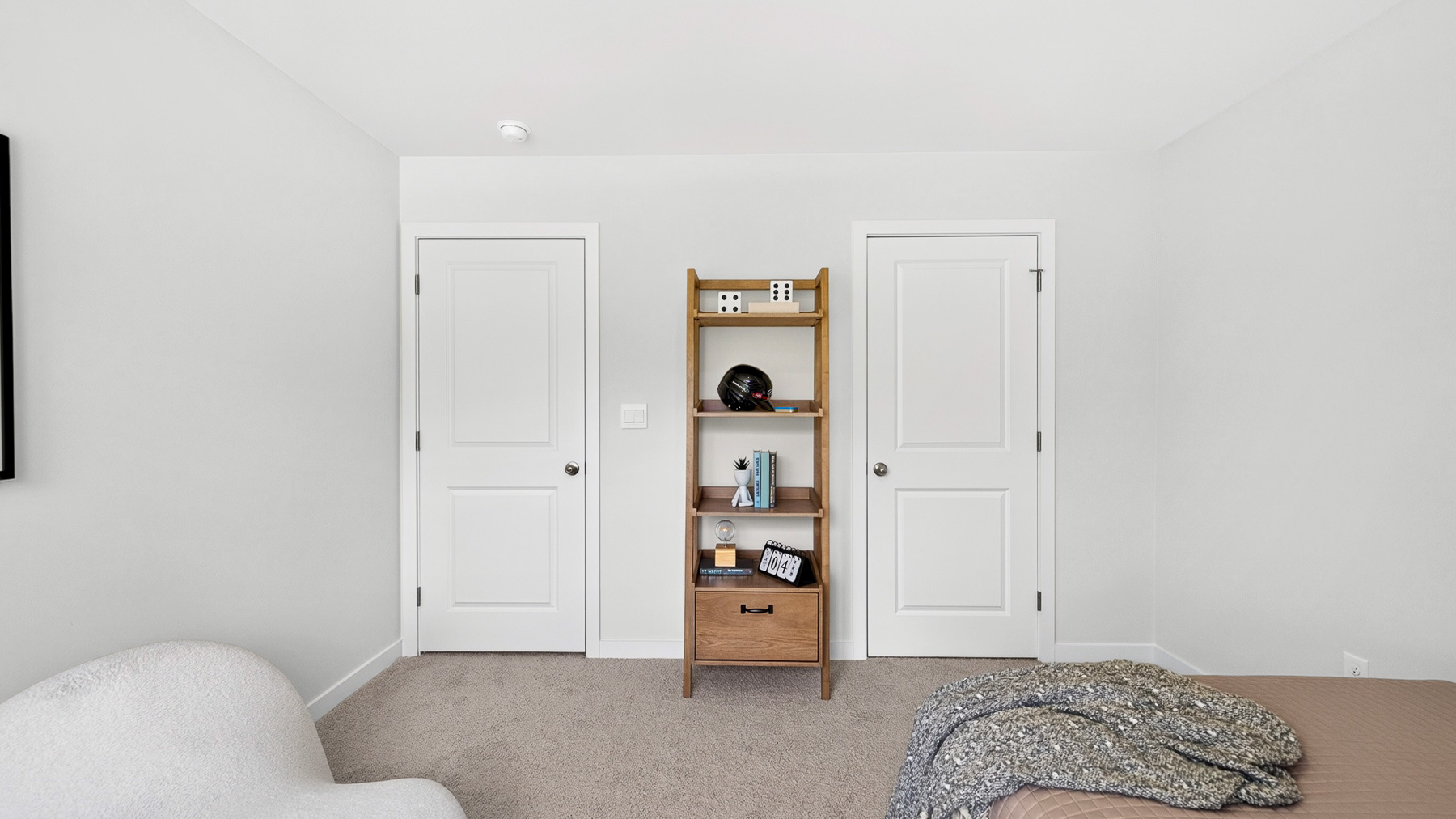 Carpeted bedroom with windows