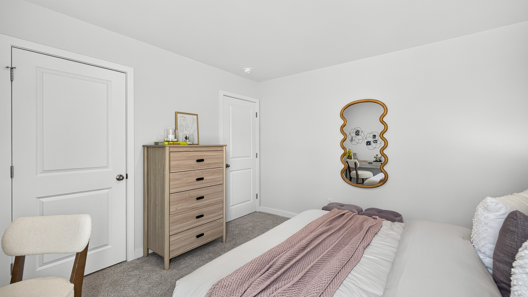 Carpeted bedroom with windows