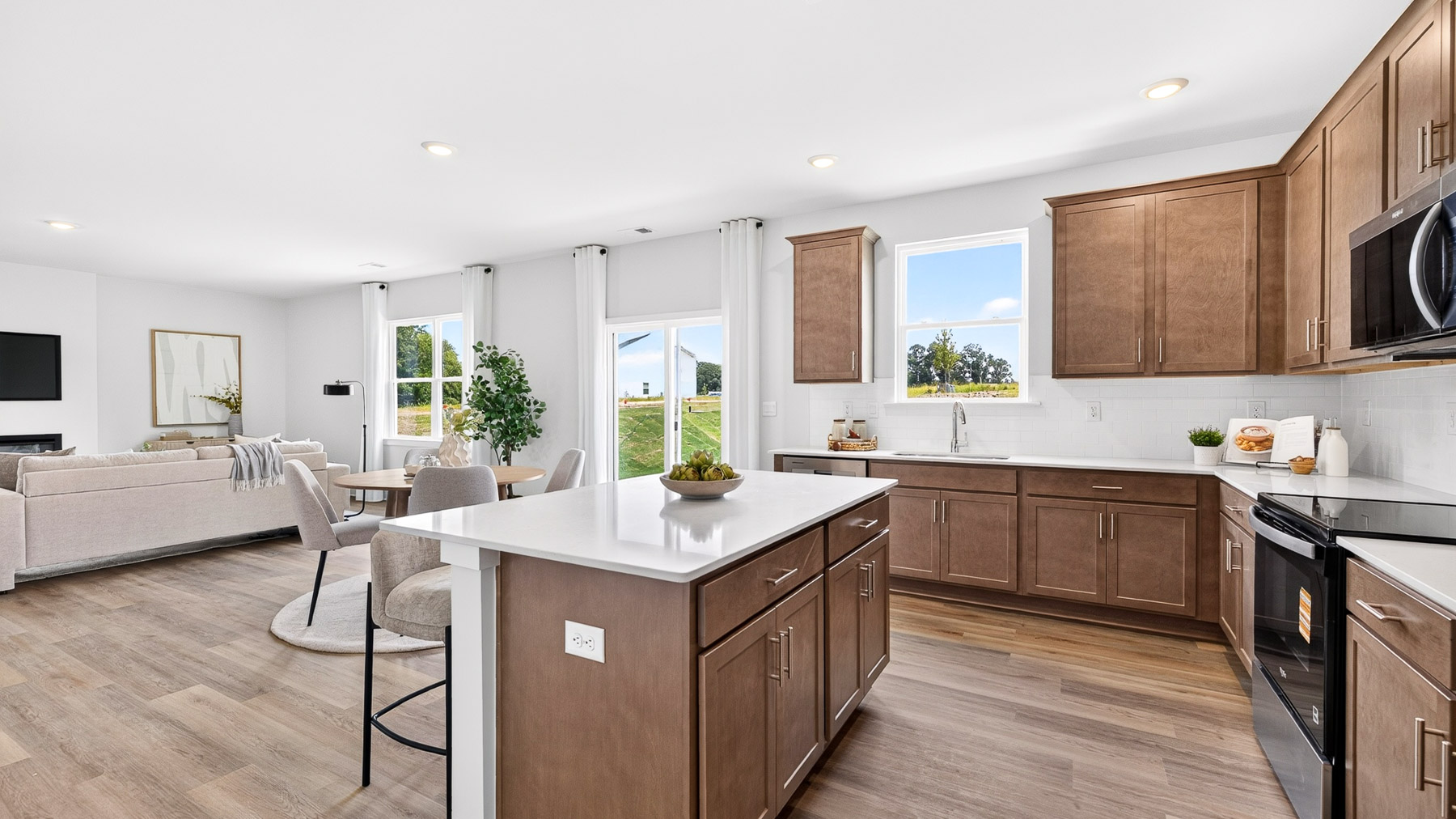 Kitchen and island with stainless steel appliances