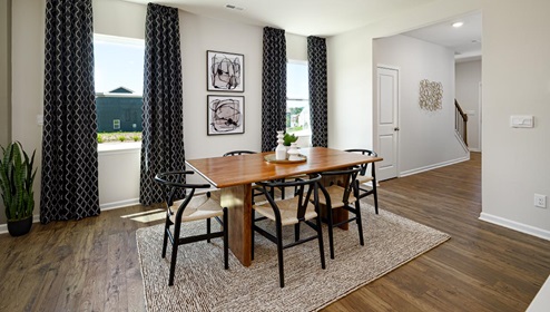 Dining area beside kitchen with two large windows. New Home in Charlotte, North Carolina