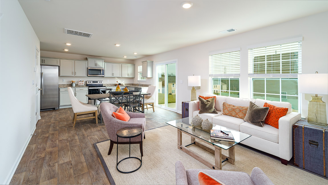 Open living room by kitchen and stairs