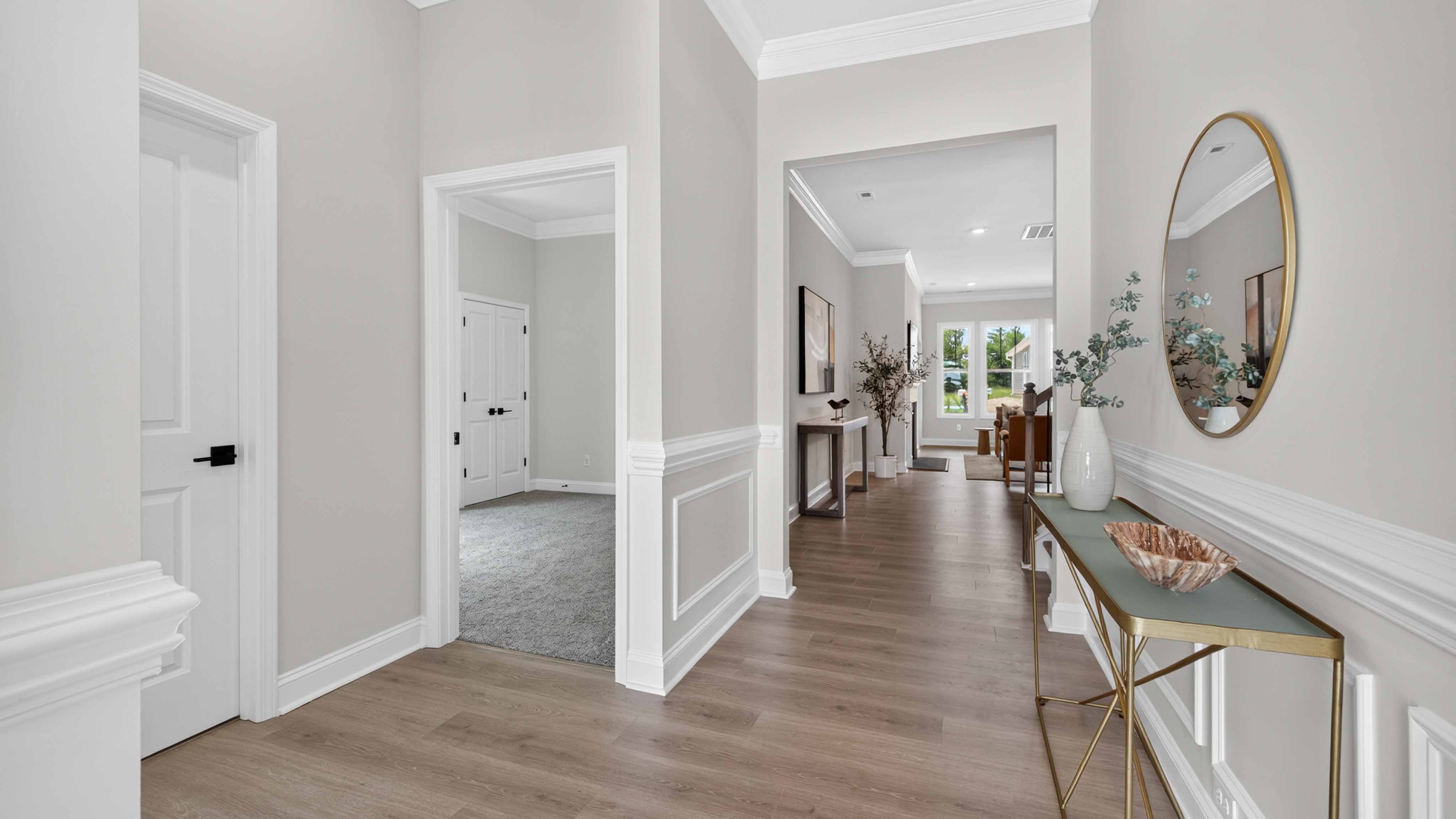 Welcoming foyer with wood floors