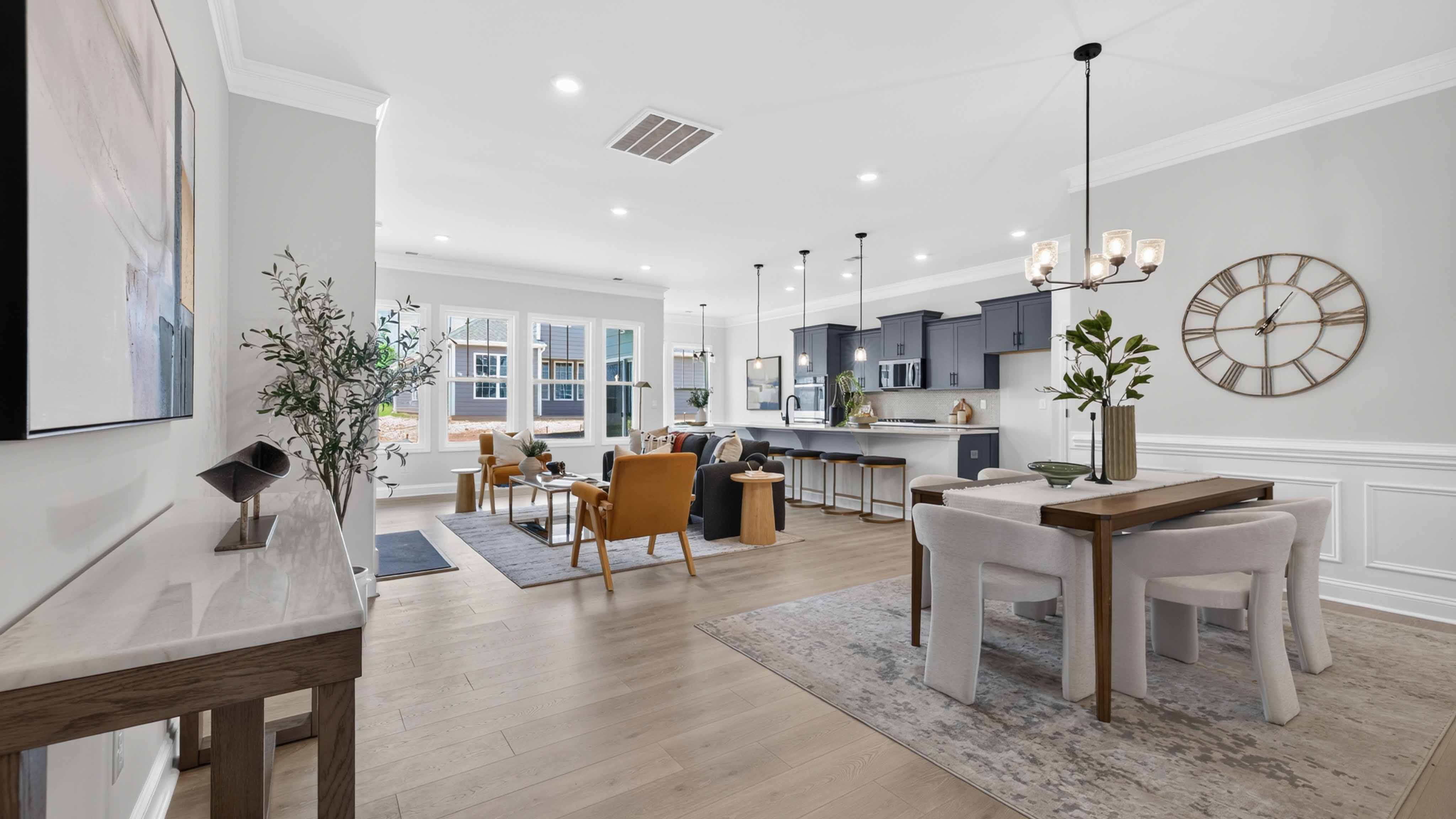 Dining area with wood floors and view of foyer
