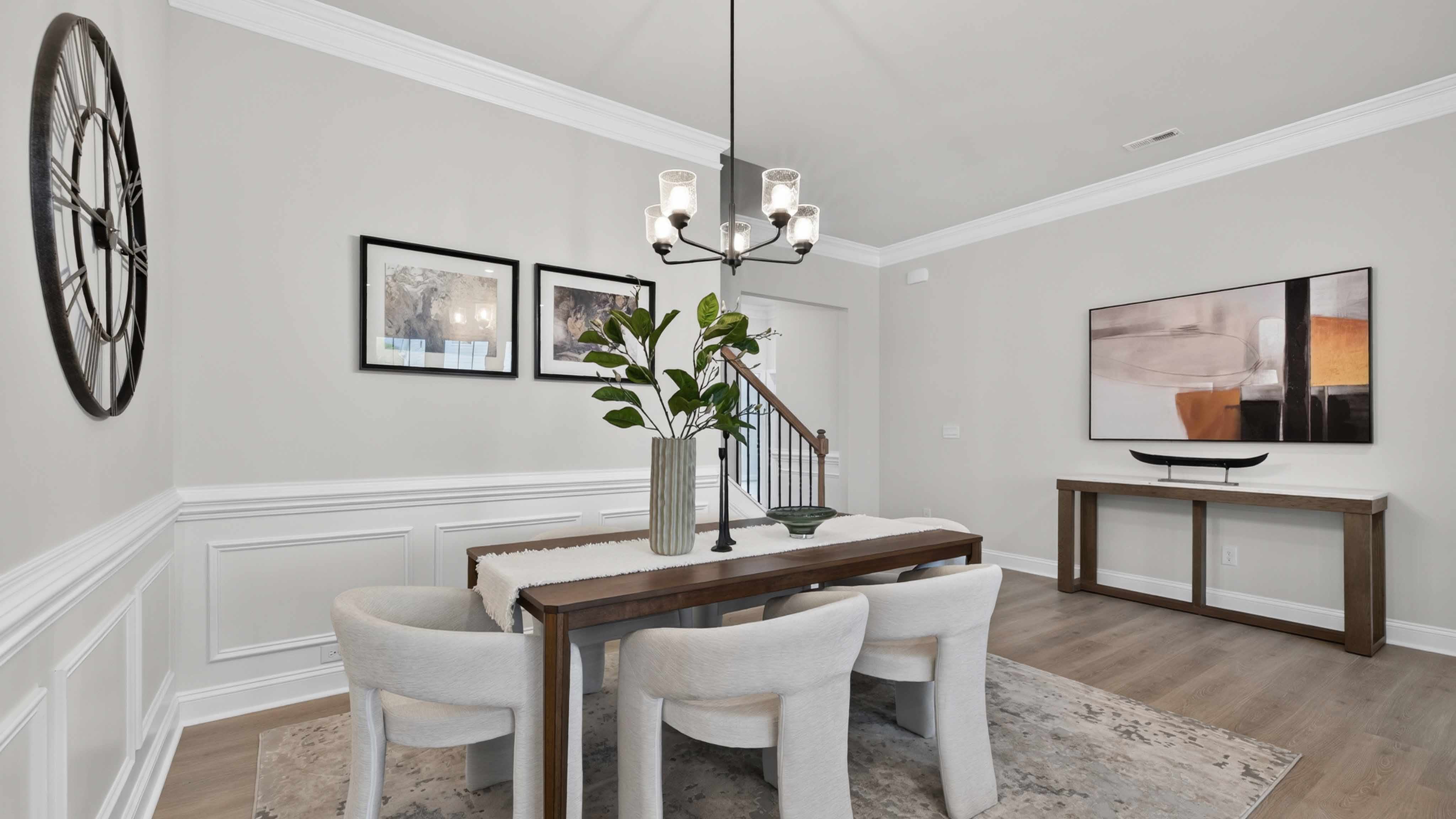 Dining area with wood floors and view of foyer